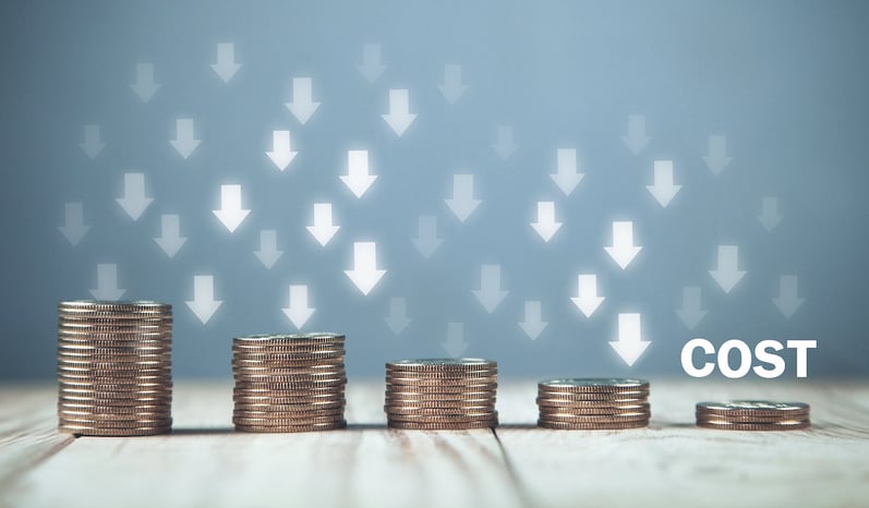 Several stacks of coins with arrows pointing down